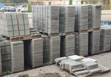 Concrete paving slabs stacked up in a builders yard