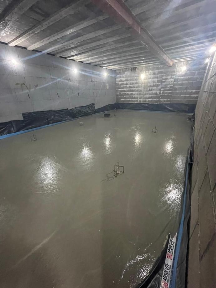 A newly laid concrete floor in a basement