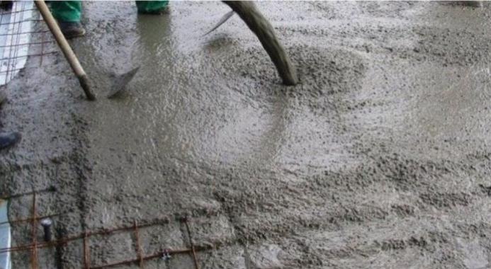 A concrete floor being poured