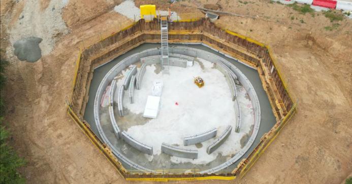 An aerial photo of concrete panels in an octagonal hole