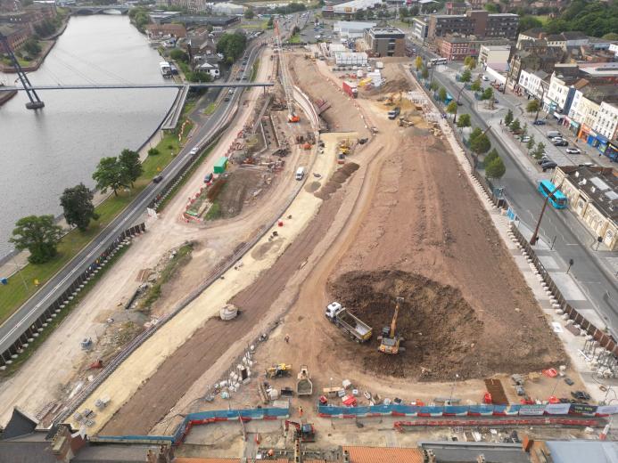 An aerial photo of a large, riverside regeneration project