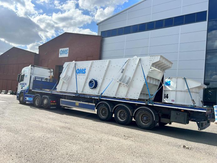 A flat bed lorry transporting an aggregate crusher