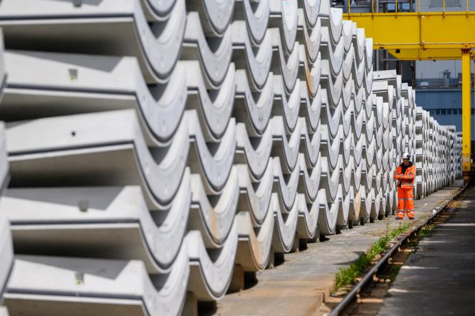 Precast concrete tunnel segments await transport to the construction site