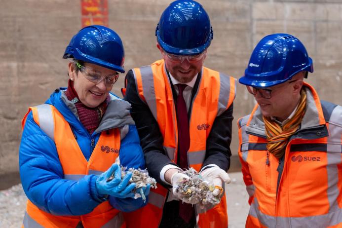 Pictured from left to right: Mary Creagh MP for Coventry East and minister of nature for DEFRA, John Slinger MP for Rugby, and Dr Adam Reid, chief external affairs and sustainability officer for SUEZ, dressed in PPE examine recycling waste