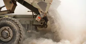 A tipper truck unloading sand