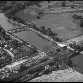 A black and white aerial photo of an under construction bridge