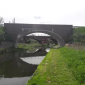 Three bridges - a new masonry clad bridge, with the original 18th century bridge and the new bridge seen through its span - on the River Ryton, in Nottinghamshire. Image: ABM Precast Solutions.