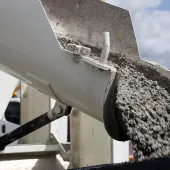 Concrete sliding off a delivery chute on a truck