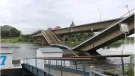 A side view of a collapsed road bridge