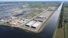 An aerial view of a large industrial dock with construction work taking place