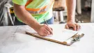 A construction worker looking at plans